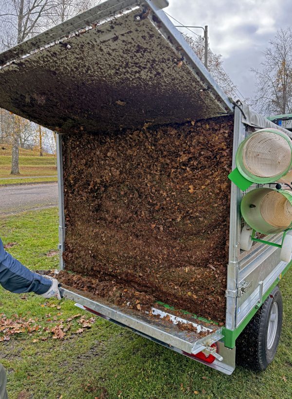 Foresteel-FT-1600-Leaf-Trailer-with-John-Deere-3R-tractor-mowing-deck-setup-08
